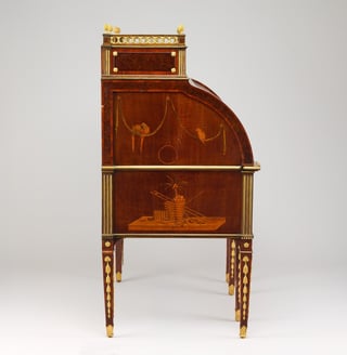 Detail of marquetry veneer and gilt bronze mounts on a rolltop desk
