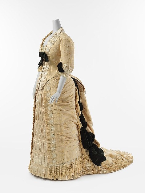 Front view of a silk dinner dress with glass-beaded trim