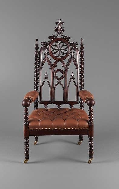 Front view of a carved mahogany Rococo Revival armchair